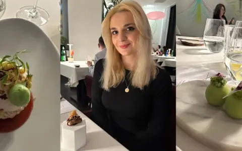 Kobieta w eleganckiej restauracji z gwiazdką Michelin w Polsce. Na stole wykwintne dania i napoje.